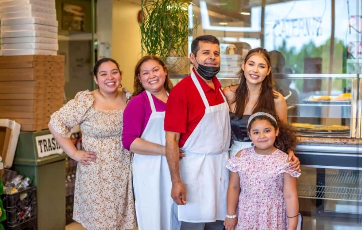 The family behind Victorious Pizzeria together at the counter